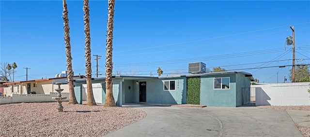 ranch-style house with central AC unit