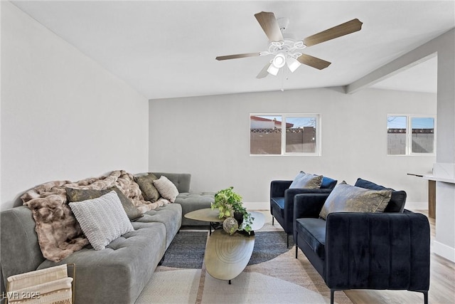 living room with beamed ceiling, ceiling fan, and light hardwood / wood-style flooring