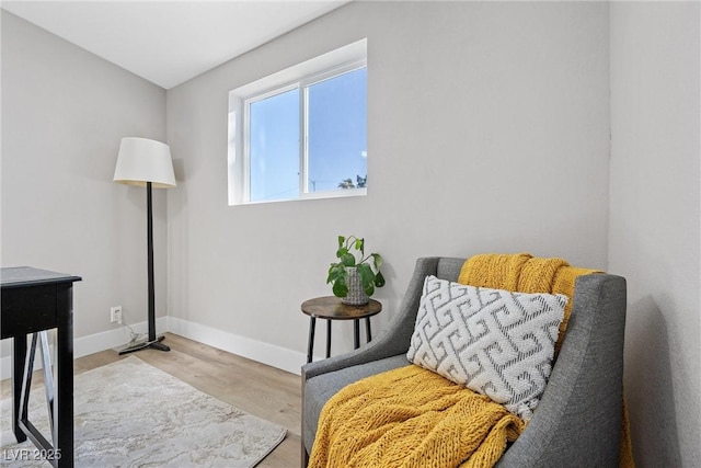 sitting room featuring light hardwood / wood-style floors