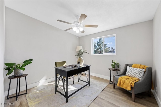 office with ceiling fan and light wood-type flooring