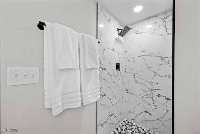 bathroom with a tile shower