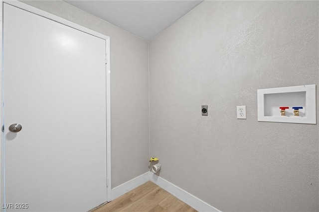 washroom with electric dryer hookup, washer hookup, and light hardwood / wood-style floors