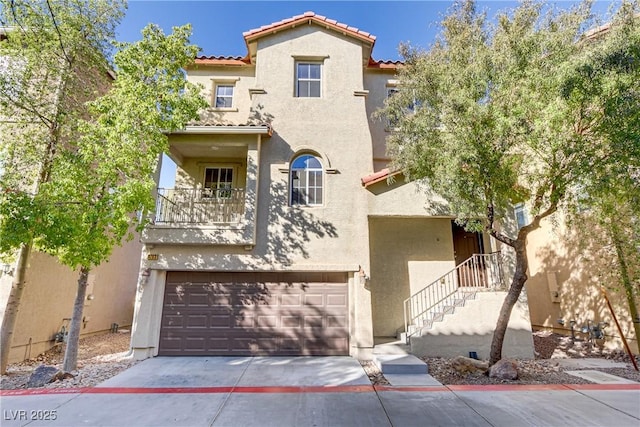 view of front of property with a balcony and a garage