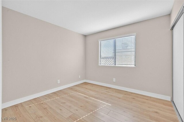 empty room with light hardwood / wood-style floors