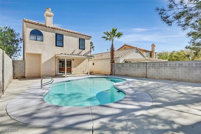 view of swimming pool with a patio area