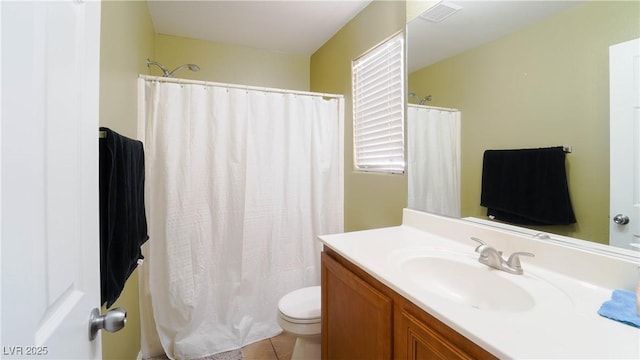 bathroom with vanity, a shower with curtain, tile patterned floors, and toilet