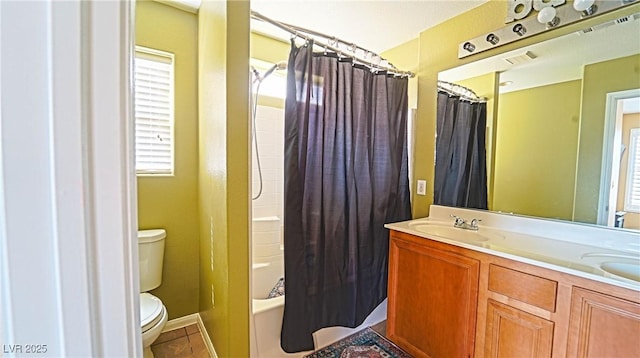 full bathroom with vanity, toilet, tile patterned flooring, and shower / tub combo