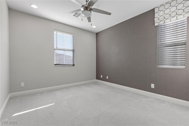 carpeted empty room with ceiling fan