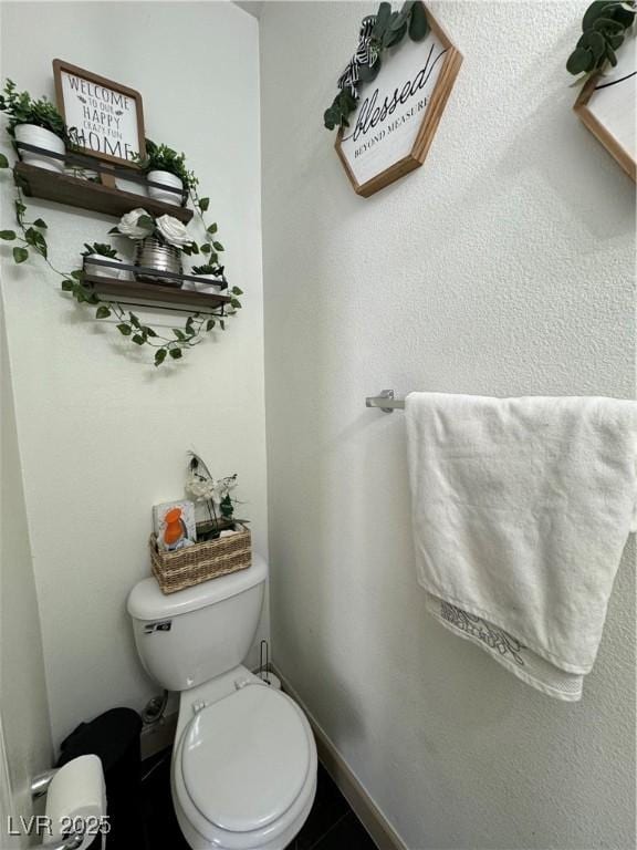 bathroom featuring toilet