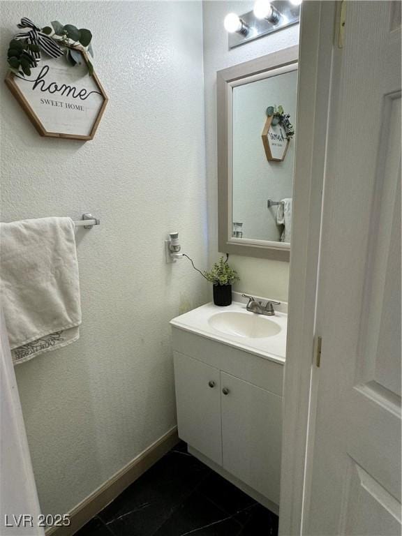 bathroom with vanity and tile patterned floors