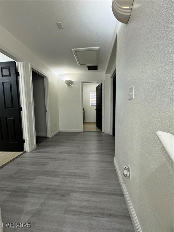 corridor featuring light hardwood / wood-style floors