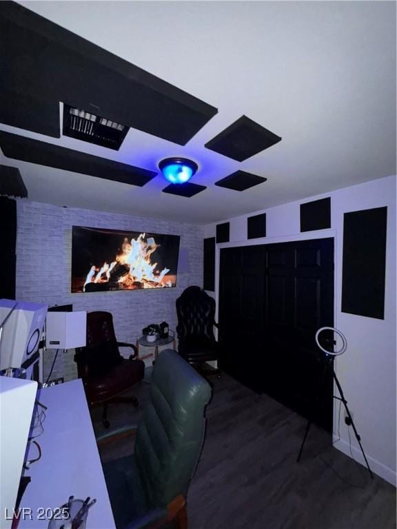 home theater room featuring hardwood / wood-style flooring