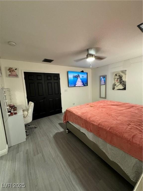 bedroom with ceiling fan and light hardwood / wood-style floors