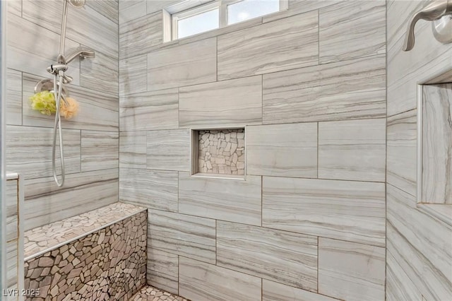 bathroom with tiled shower