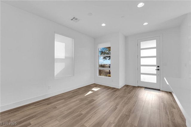 foyer with light hardwood / wood-style floors