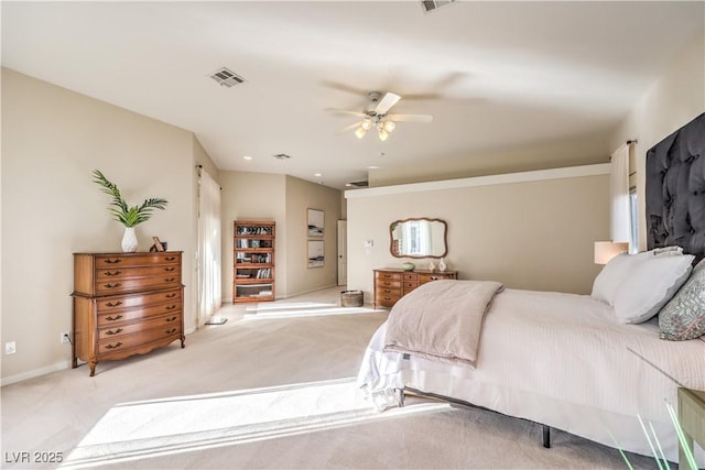 bedroom with ceiling fan and light carpet