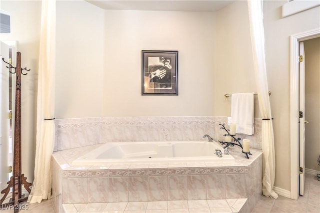 bathroom with tile patterned floors and tiled bath