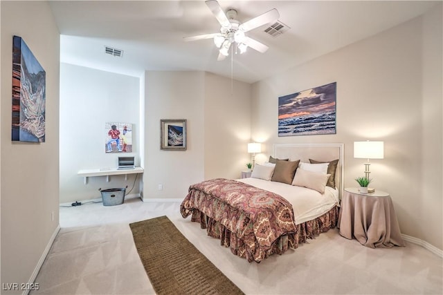 bedroom featuring light colored carpet and ceiling fan