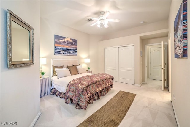 bedroom featuring light carpet, a closet, and ceiling fan