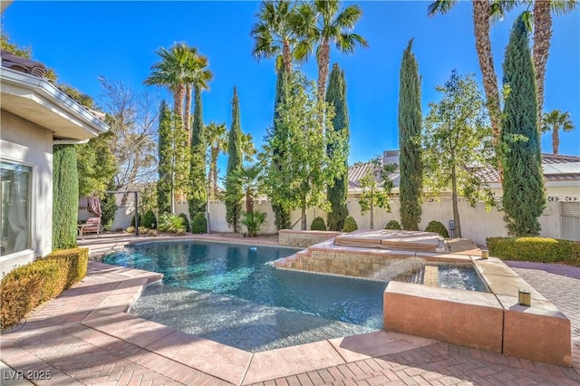 view of swimming pool featuring a patio and an in ground hot tub