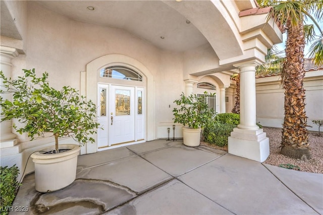 property entrance featuring a patio