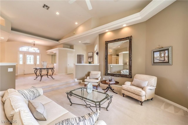 living room featuring light colored carpet and high vaulted ceiling