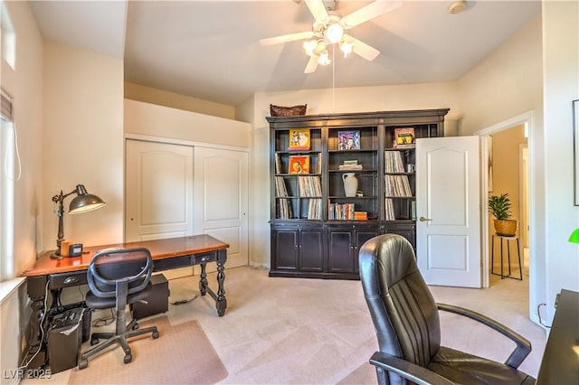 carpeted home office with ceiling fan