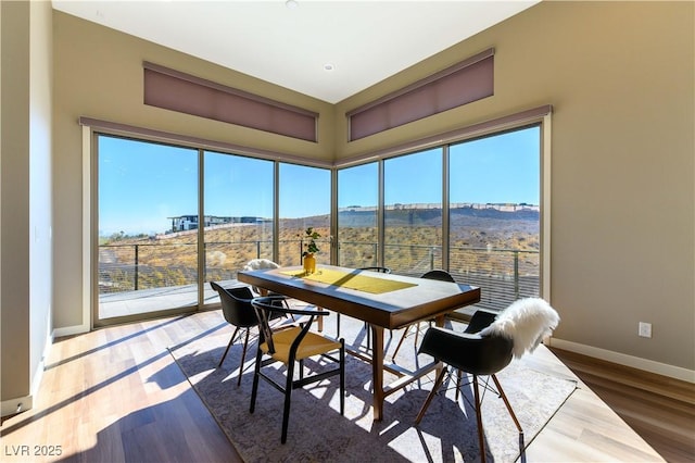 sunroom / solarium featuring a mountain view