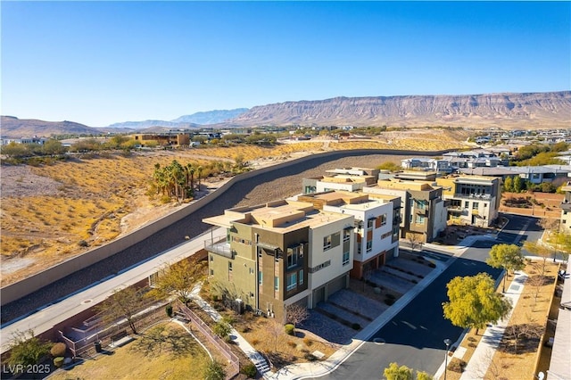 birds eye view of property featuring a mountain view