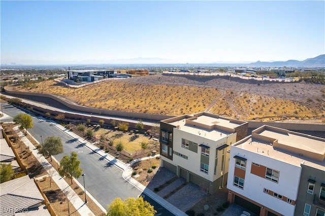 birds eye view of property featuring a mountain view