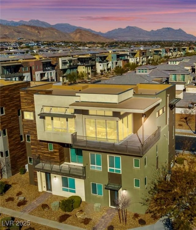 outdoor building at dusk featuring a mountain view