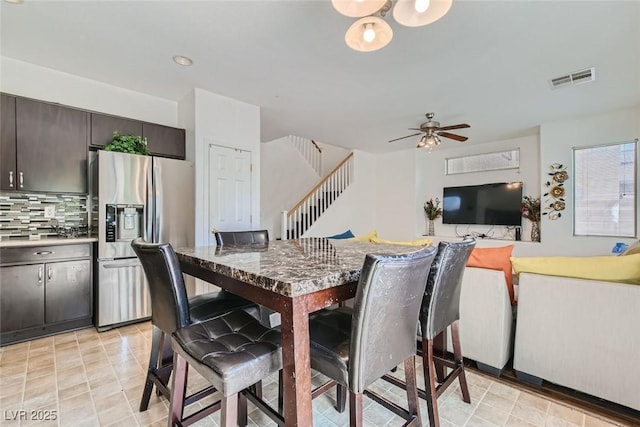 dining space with ceiling fan