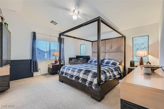 bedroom featuring ceiling fan, lofted ceiling, and carpet flooring