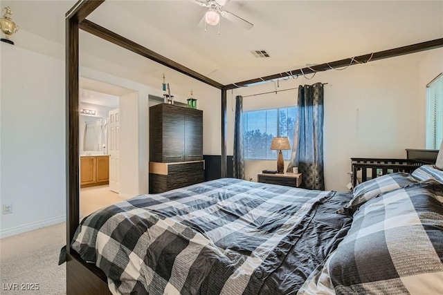 carpeted bedroom with lofted ceiling and connected bathroom