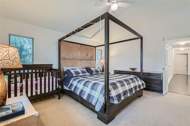 carpeted bedroom featuring ceiling fan