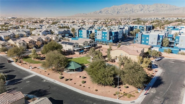 birds eye view of property with a mountain view