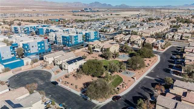 birds eye view of property with a mountain view