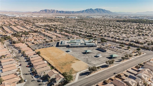 birds eye view of property with a mountain view