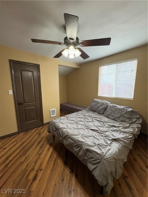 bedroom featuring dark hardwood / wood-style floors and ceiling fan