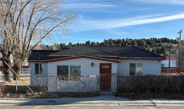 1085 Lyons Ave, Ely, NV 89301 - view of front of property with stucco siding and a fenced front yard