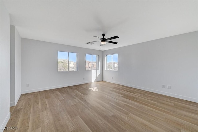 unfurnished room with light hardwood / wood-style floors and ceiling fan