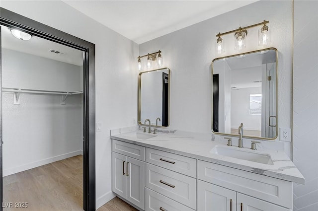 bathroom with wood-type flooring and vanity