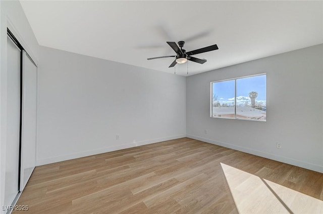 unfurnished bedroom featuring a closet, ceiling fan, and light hardwood / wood-style flooring