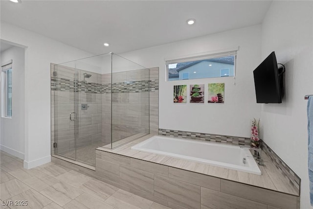 bathroom featuring plus walk in shower