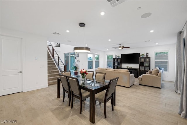 dining room featuring light hardwood / wood-style flooring and ceiling fan