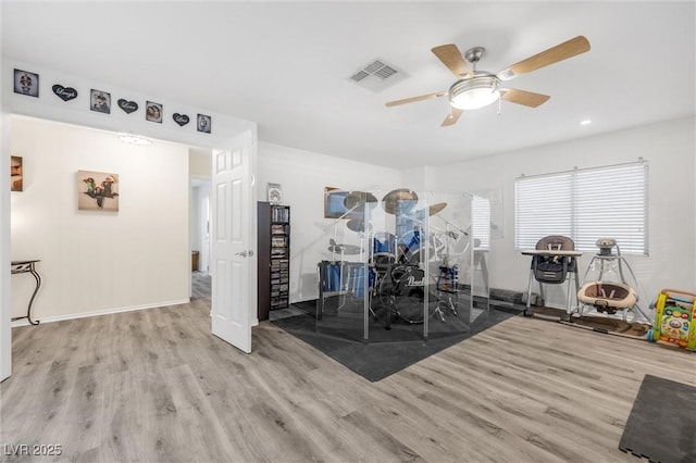 interior space with light hardwood / wood-style floors and ceiling fan