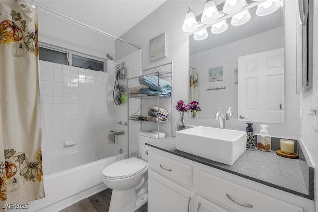 full bathroom featuring vanity, wood-type flooring, toilet, and shower / bath combo with shower curtain