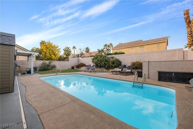 view of pool with a patio and a jacuzzi