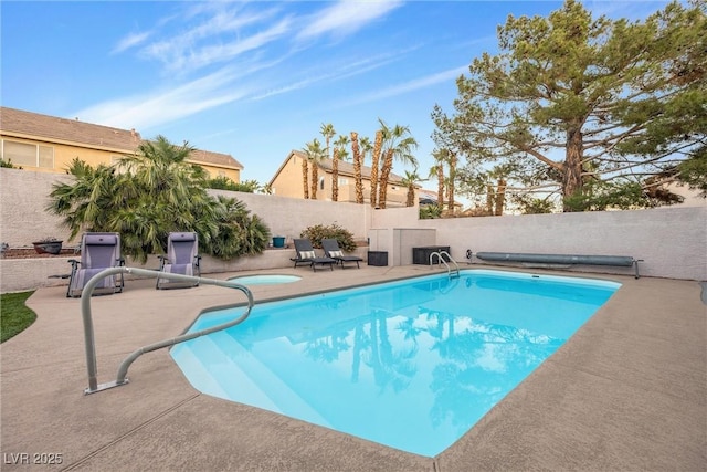 view of swimming pool featuring a patio