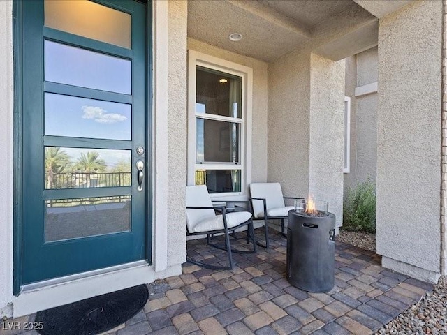 doorway to property featuring a patio area